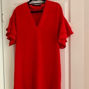 Red short loose fitting dress.